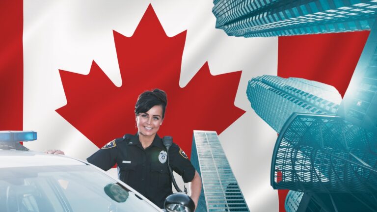 Canadian Police Officer Standing in Front of The Canada Flag and City Buildings