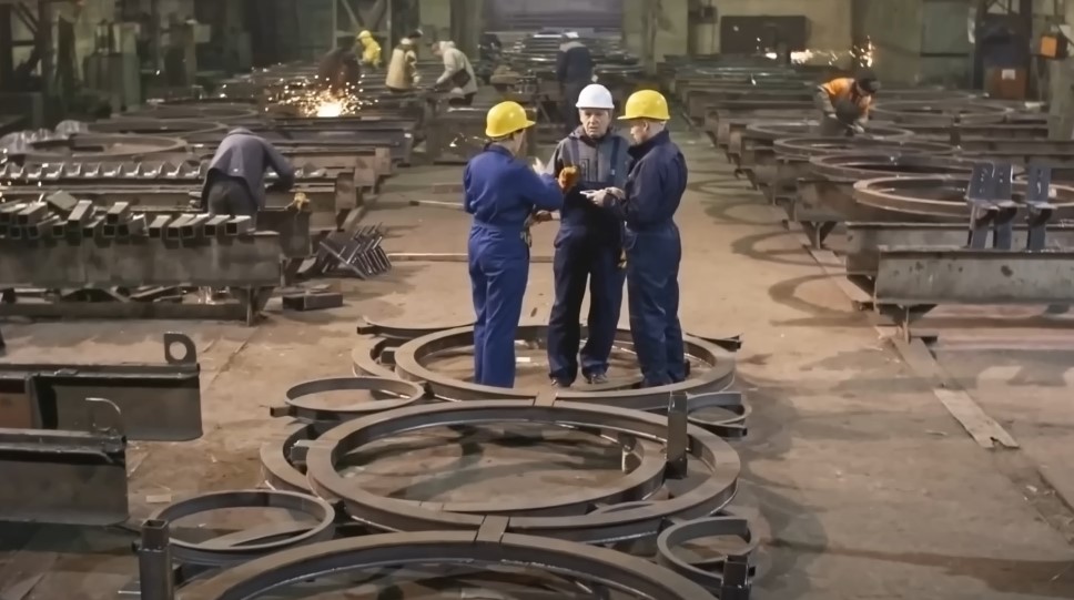 Workers in Detroit steel factory