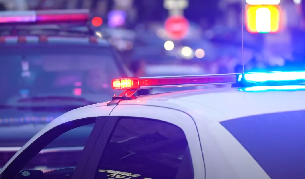 Police car with red and blue lights on the roof