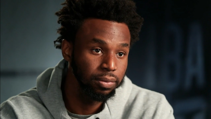 Andrew Wiggins looks focused during an interview