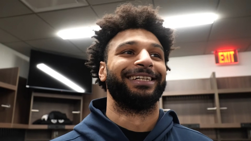 Jamal Murray smiles during a locker room interview