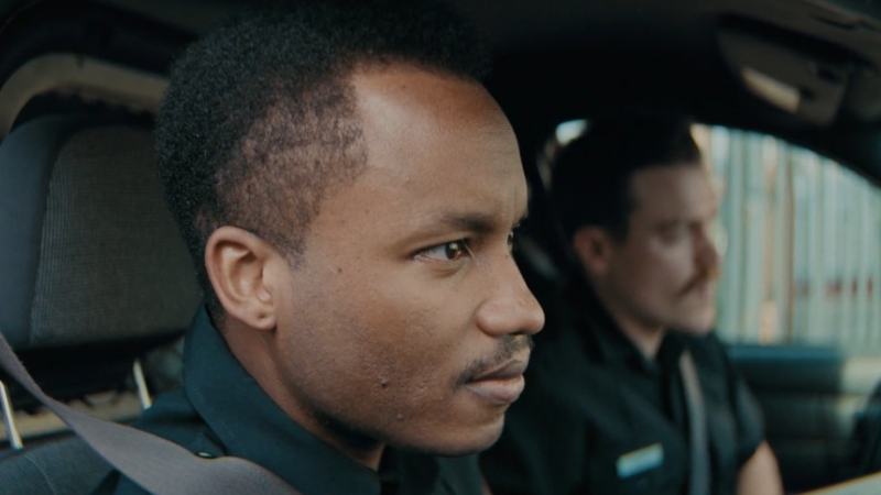 Two Ottawa police officers sit inside a patrol vehicle during routine duty