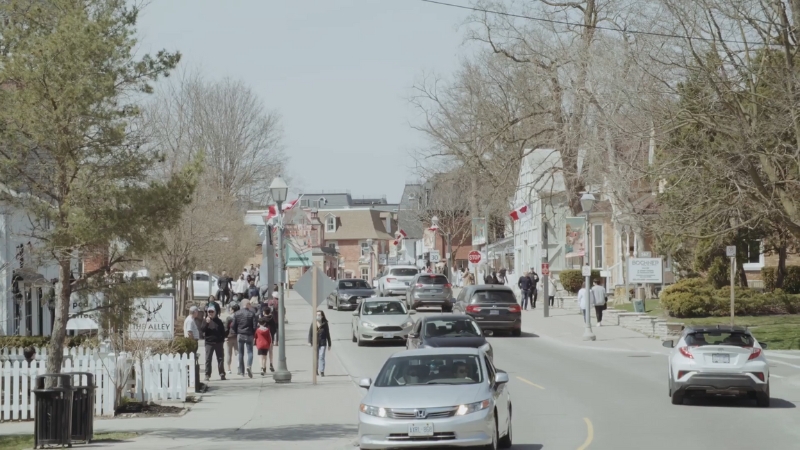 Street scene in Markham showing families, pedestrians, and everyday activity shaped by immigration-driven population growth