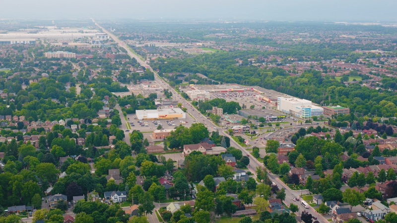 Aerial view shows Brampton neighborhoods with low-rise housing and larger household patterns