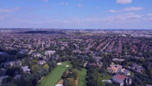 Aerial view showing Vaughan population density with suburban neighborhoods in the foreground and high-rise growth areas in the distance