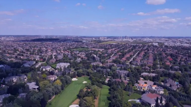 Aerial view showing Vaughan population density with suburban neighborhoods in the foreground and high-rise growth areas in the distance